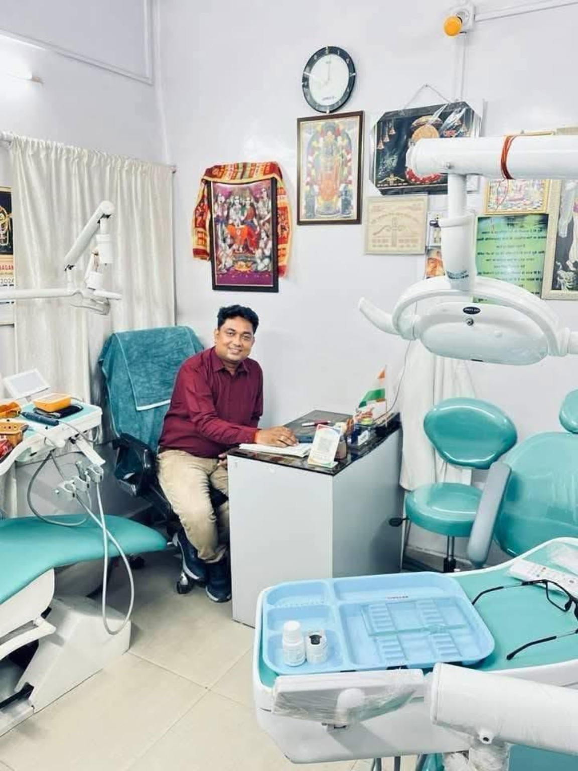 Dr. Anish sitting in the dental clinic